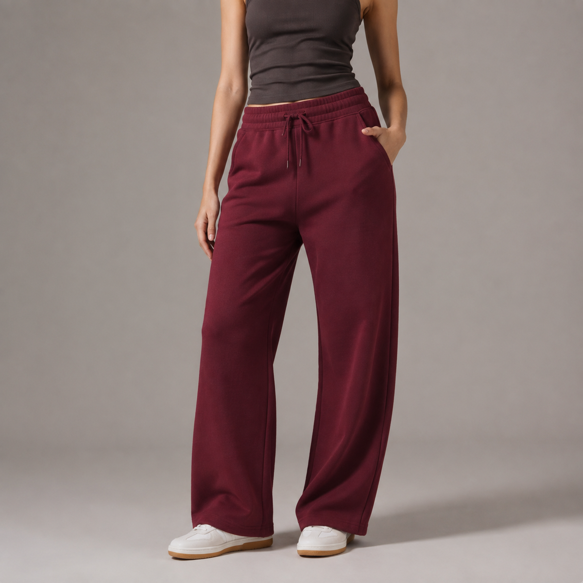 Wine red TELLS straight-leg sweatpants showing a clean full-length trouser line