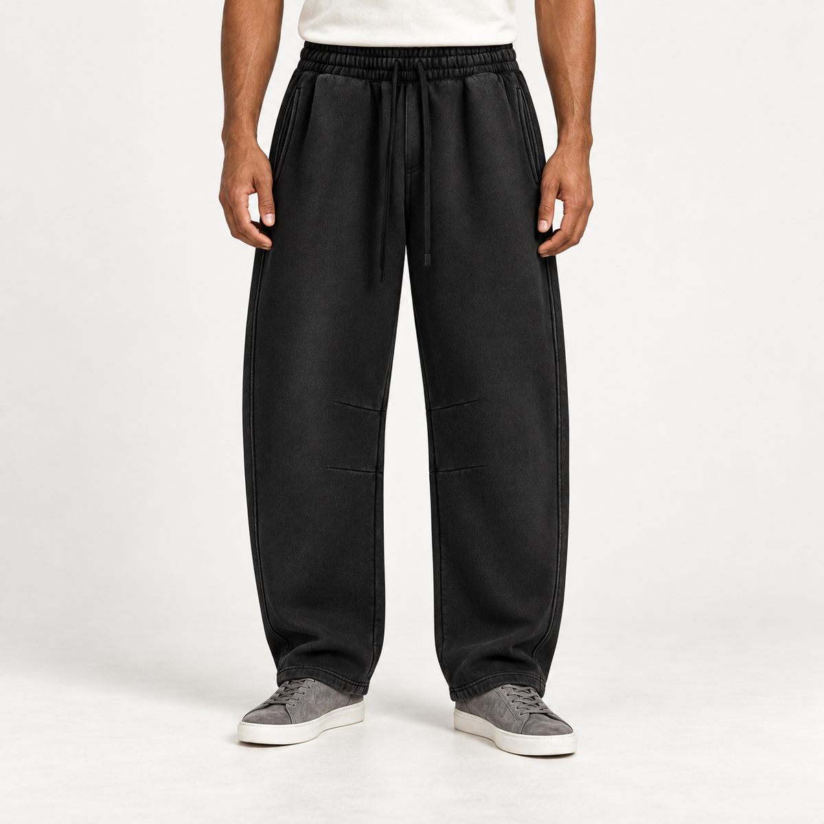 Black TELLS barrel fleece sweatpants showing a sculpted relaxed silhouette