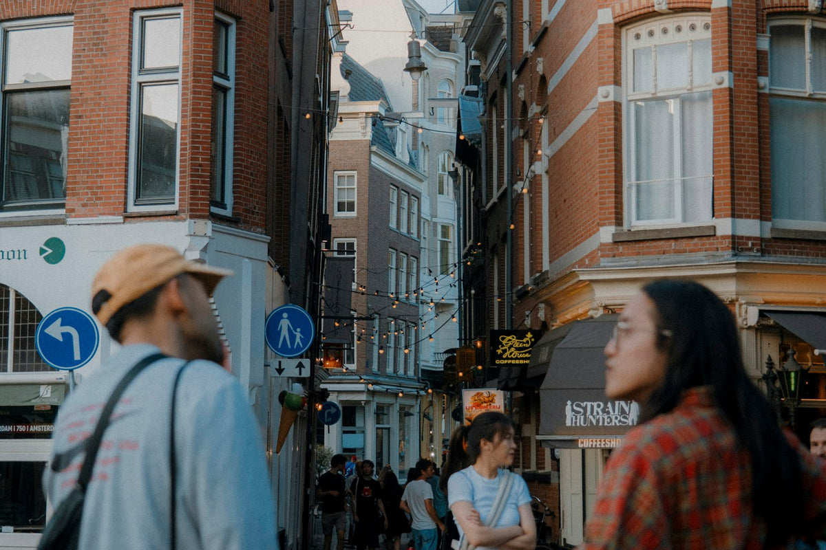 People walking through an Amsterdam street during a city break