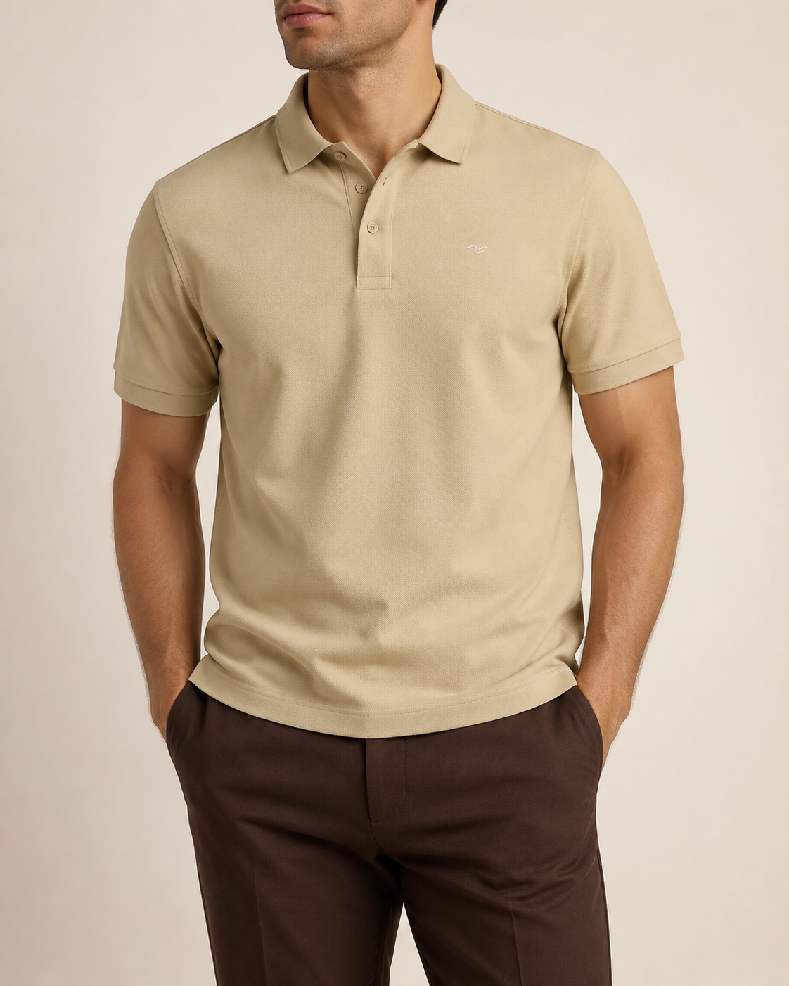 TELLS Meridian Pique Polo in sand showing the textured cotton fabric