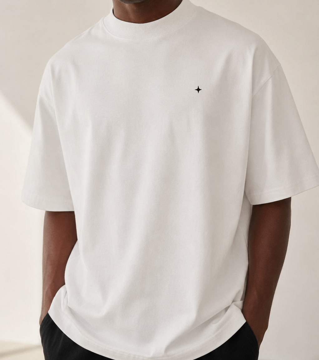 Close view of the ribbed crew neckline on a TELLS white oversized T-shirt