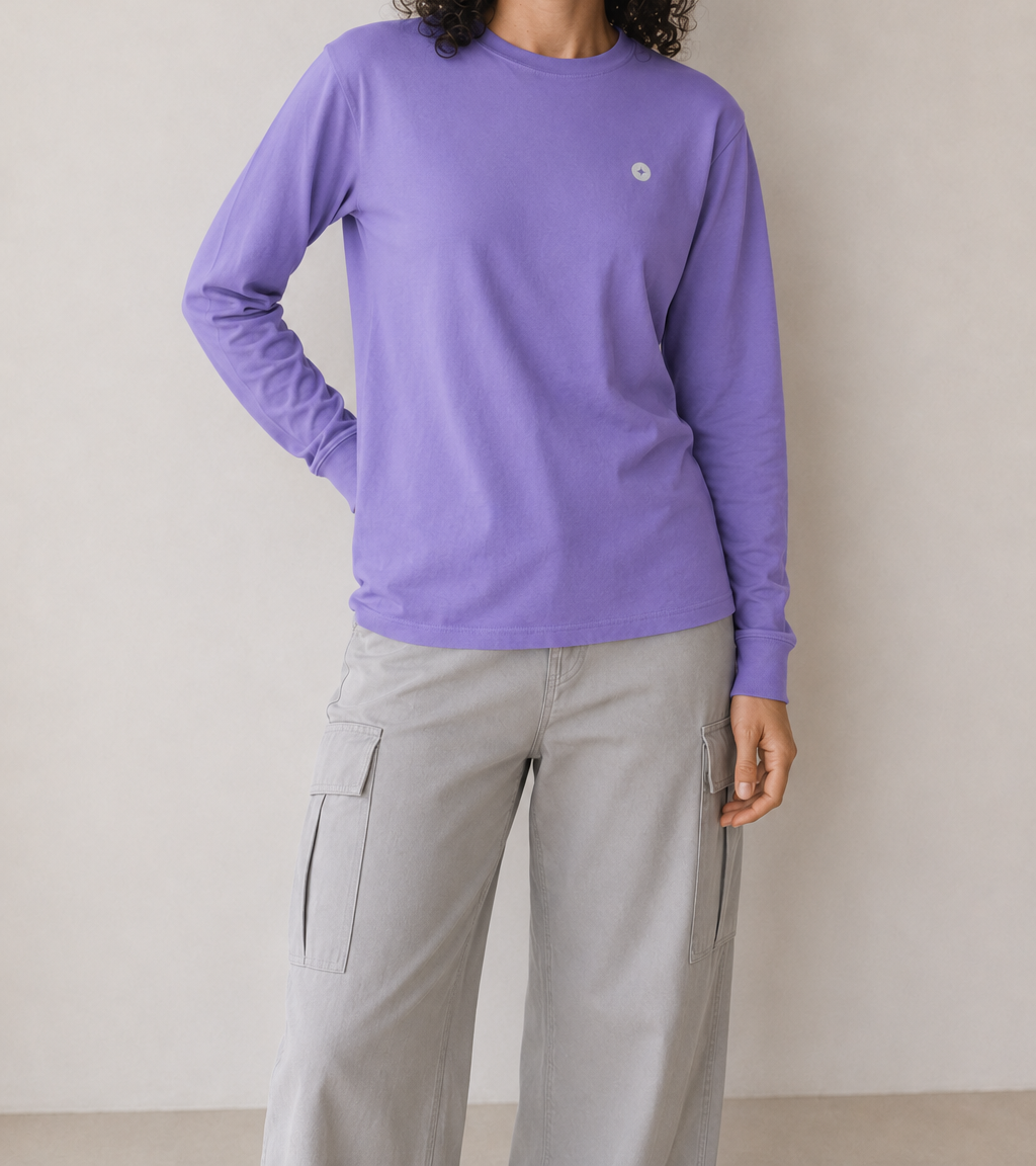 Woman wearing a purple TELLS long sleeve T shirt as an example of colour near the face
