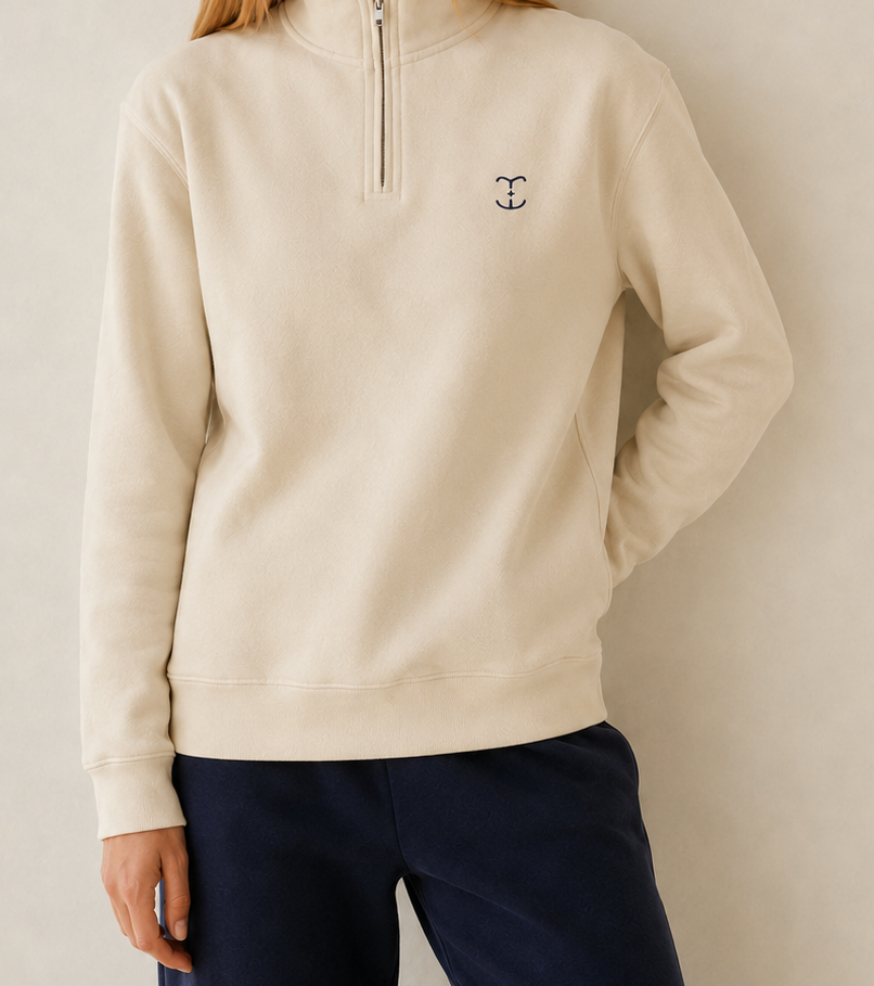 Beige TELLS quarter-zip sweatshirt styled as a versatile autumn travel layer