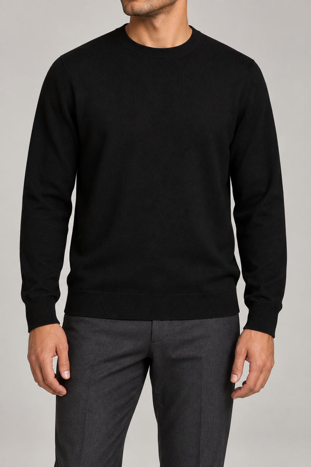 Front studio view of Still Hours Crewneck Sweater in Black, showing the plain knit body and crew neckline.