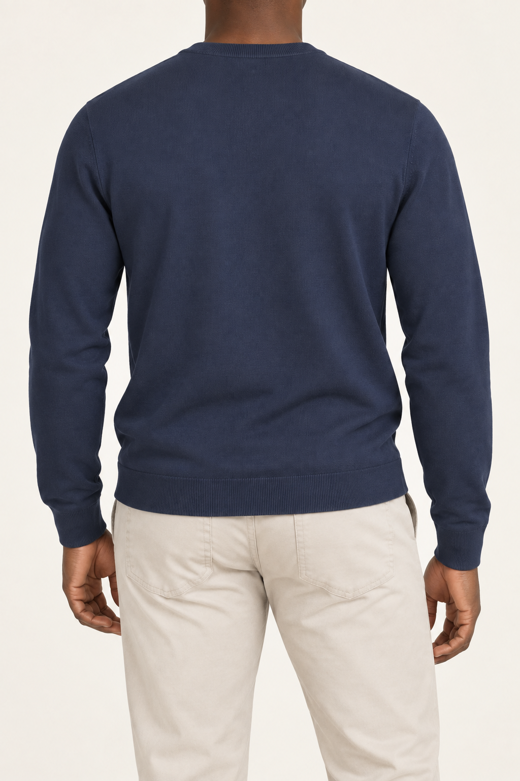 Rear studio view of Still Hours Crewneck Sweater in Navy, showing the unadorned back and long sleeves.