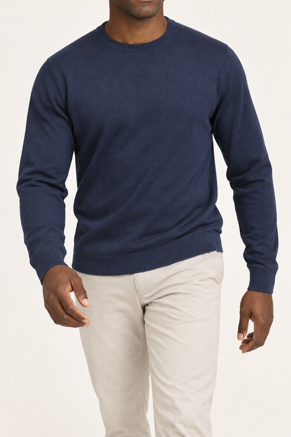 Walking studio view of Still Hours Crewneck Sweater in Navy, showing the natural drape of the plain knit.