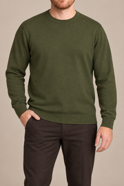 Front studio view of Still Hours Crewneck Sweater in Olive, showing the plain front and crew neckline.