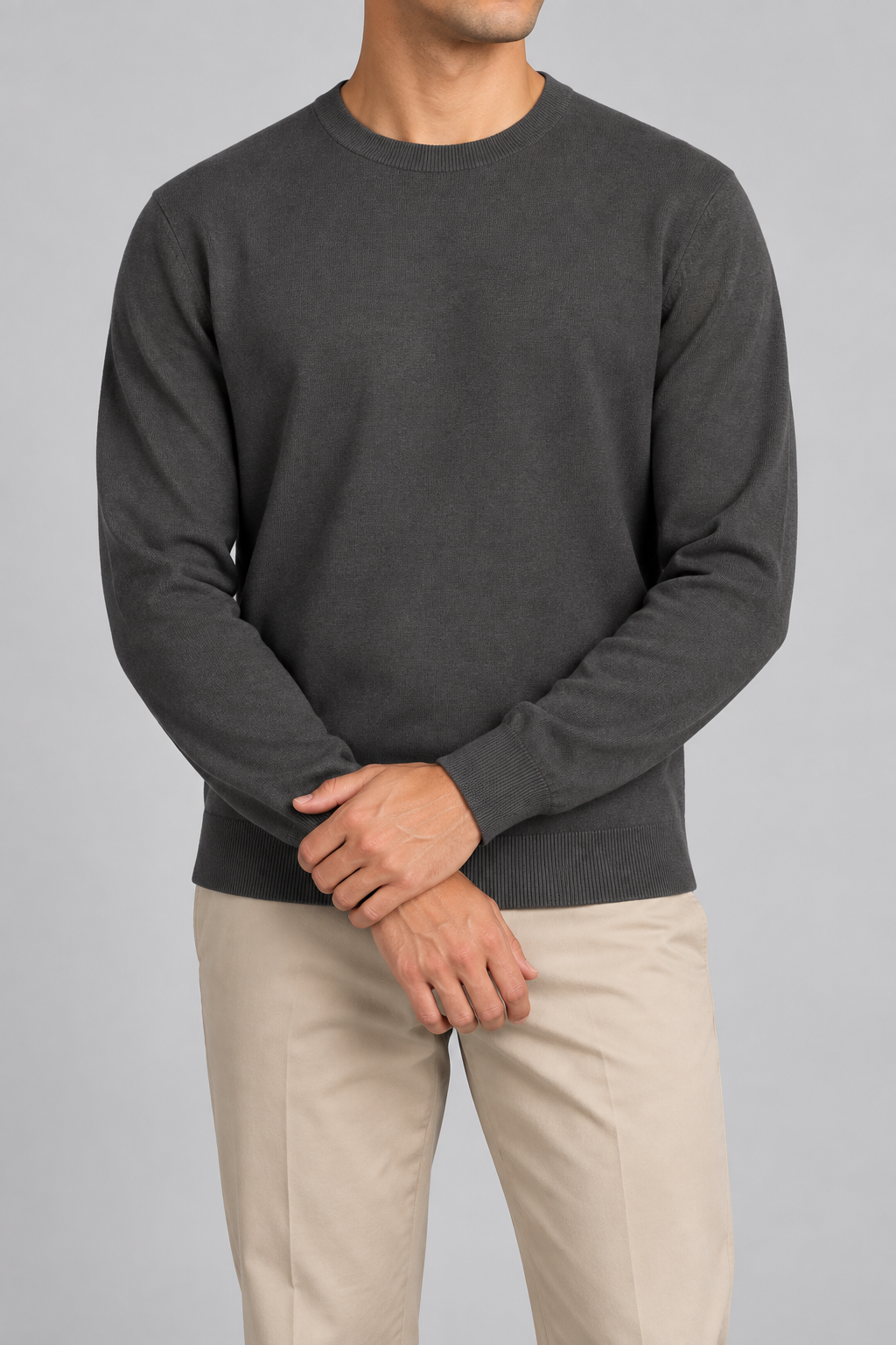 Front studio view of Still Hours Crewneck Sweater in Charcoal, showing the plain front and crew neckline.