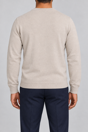Rear studio view of Still Hours Crewneck Sweater in Sand, showing the unadorned back and long sleeves.
