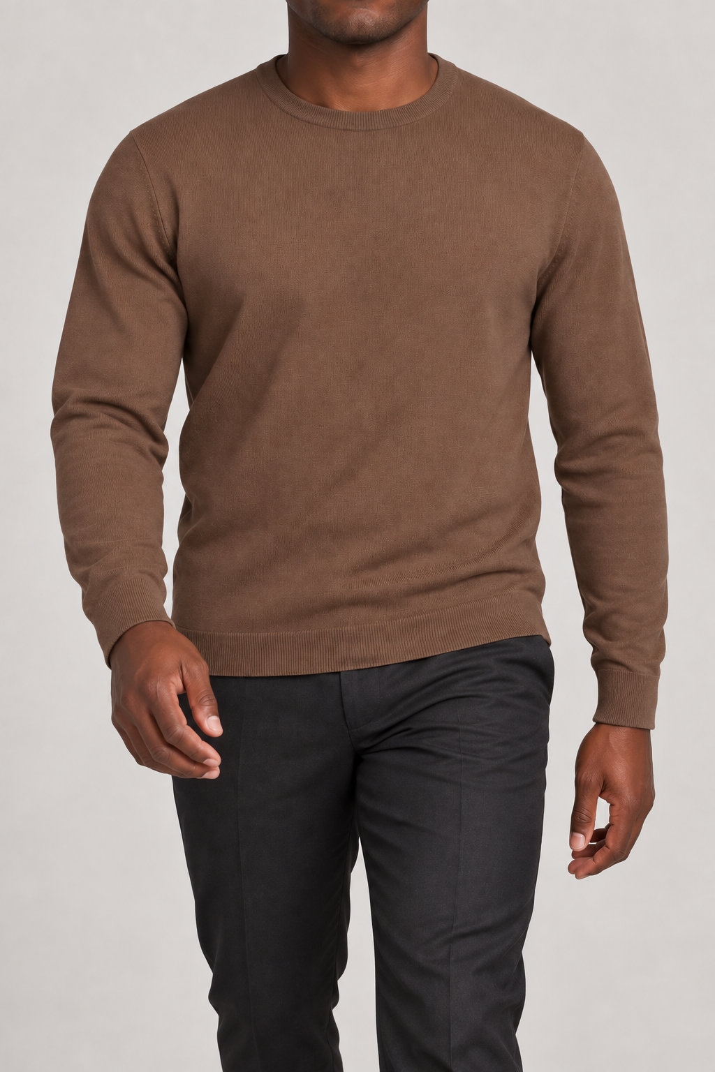 Walking studio view of Still Hours Crewneck Sweater in Toffee, showing the natural drape of the plain knit.