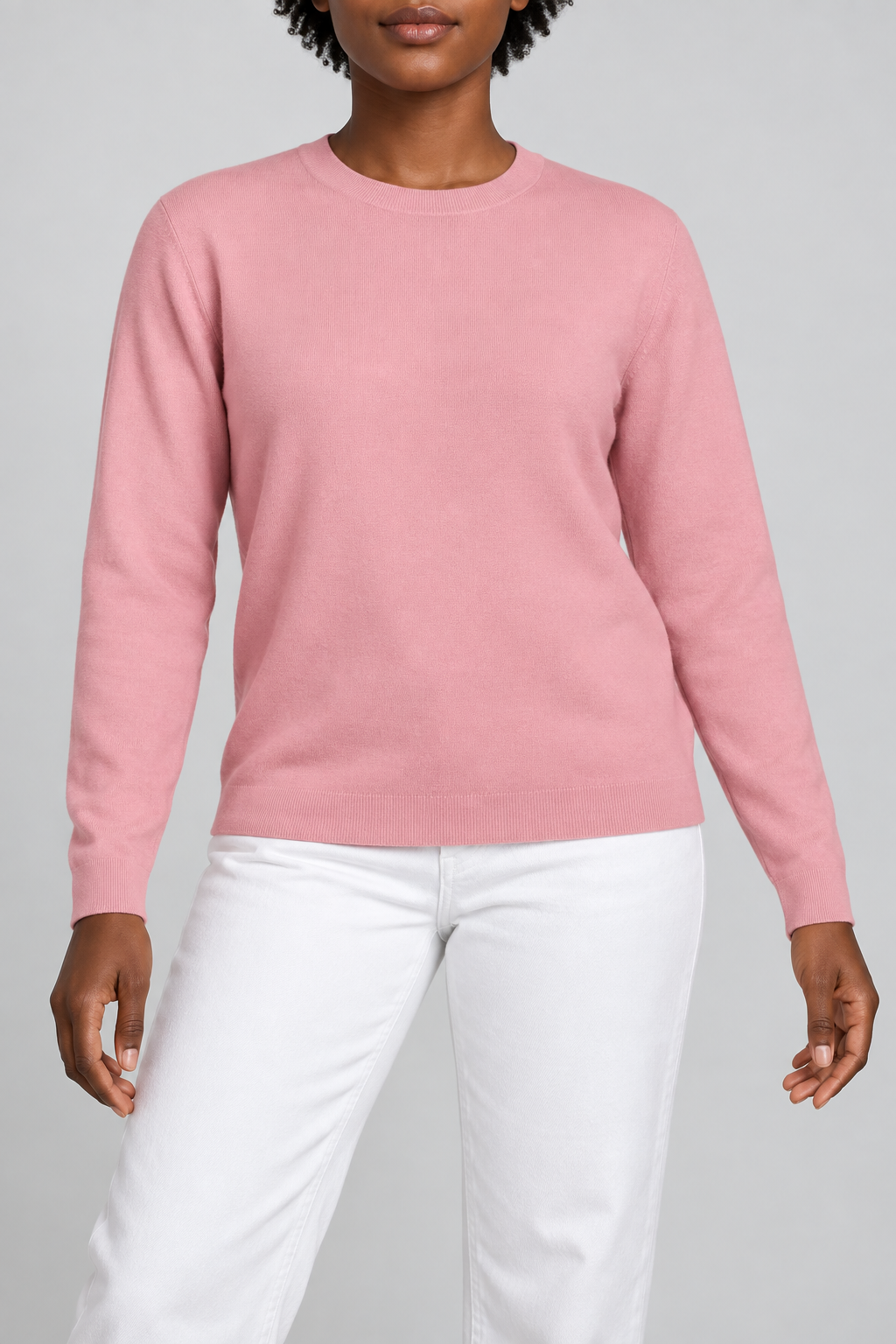 Front studio view of Quiet Form Crewneck Sweater in Pink, showing the plain knit and classic fit.