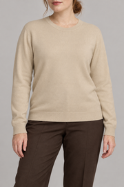 Front studio view of Quiet Form Crewneck Sweater in Beige, showing the plain knit and classic fit.