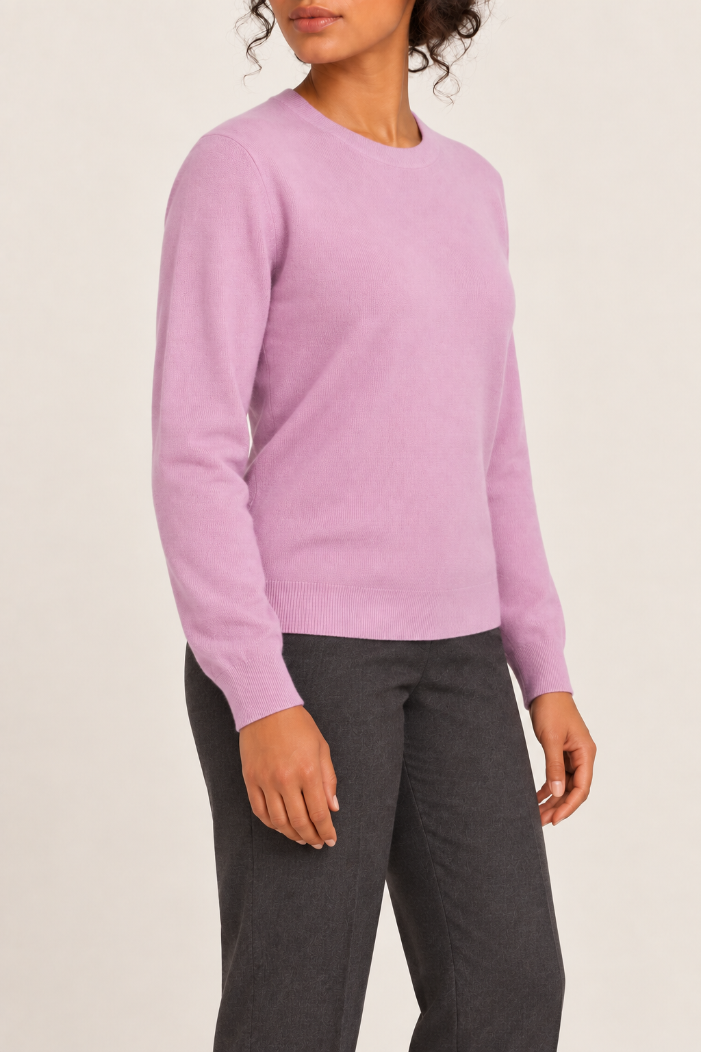 Three-quarter studio view of Quiet Form Crewneck Sweater in Lilac, showing the long sleeves and classic silhouette.