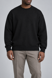 Front studio view of Slow Days Relaxed Crewneck in Black, showing the plain knit and relaxed fit.