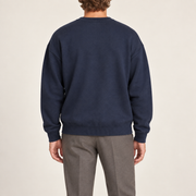Rear studio view of Slow Days Relaxed Crewneck in Navy, showing the plain back and ribbed hem.