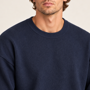 Close-up neckline detail of Slow Days Relaxed Crewneck in Navy, showing the fine knit and ribbed crew collar.