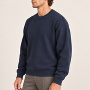 Three-quarter studio view of Slow Days Relaxed Crewneck in Navy, showing the dropped shoulders and roomy silhouette.