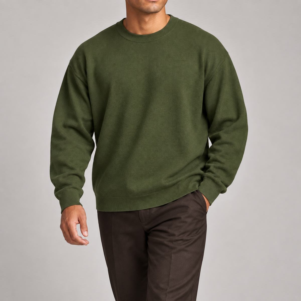 Slow Days Relaxed Crewneck in Olive. Natural movement studio view showing the olive sweater drape.