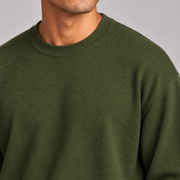 Slow Days Relaxed Crewneck in Olive. Close-up showing the olive knit texture and crew neckline.