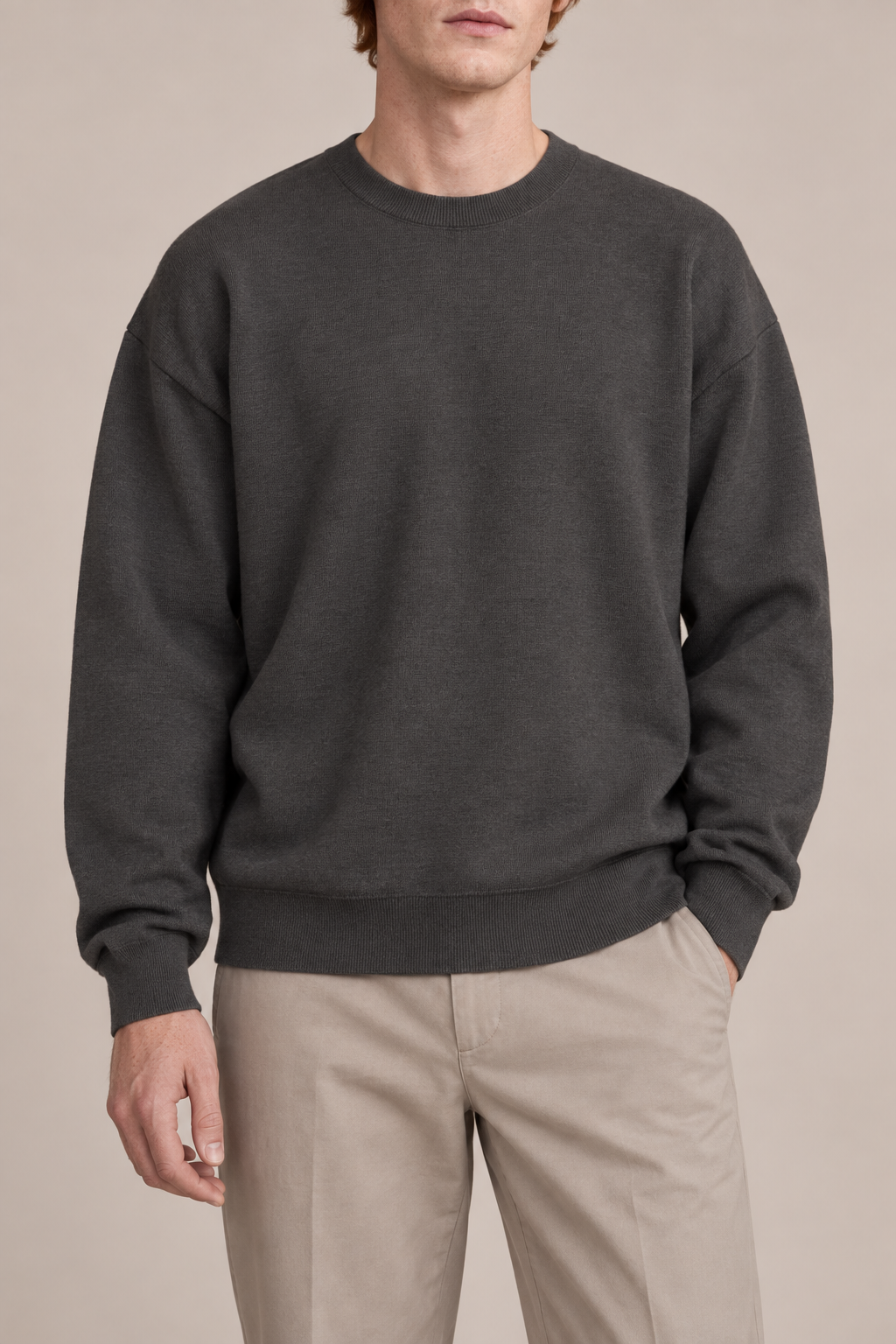 Slow Days Relaxed Crewneck in Charcoal. Front view of the plain charcoal knit and relaxed crew neckline.