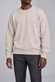 Slow Days Relaxed Crewneck in Sand. Front view of the plain Sand knit and relaxed crew neckline.