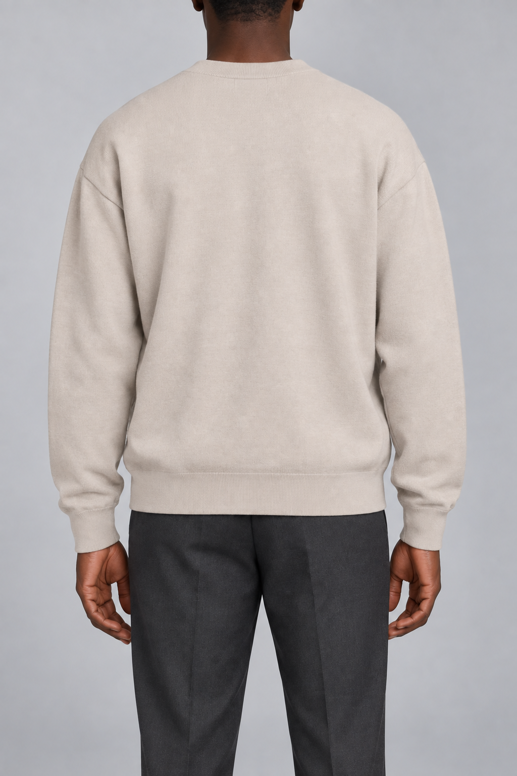 Slow Days Relaxed Crewneck in Sand. Rear view of the plain Sand back and ribbed hem.