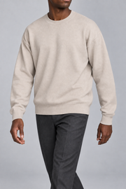 Slow Days Relaxed Crewneck in Sand. Movement view showing the Sand sweater natural drape.