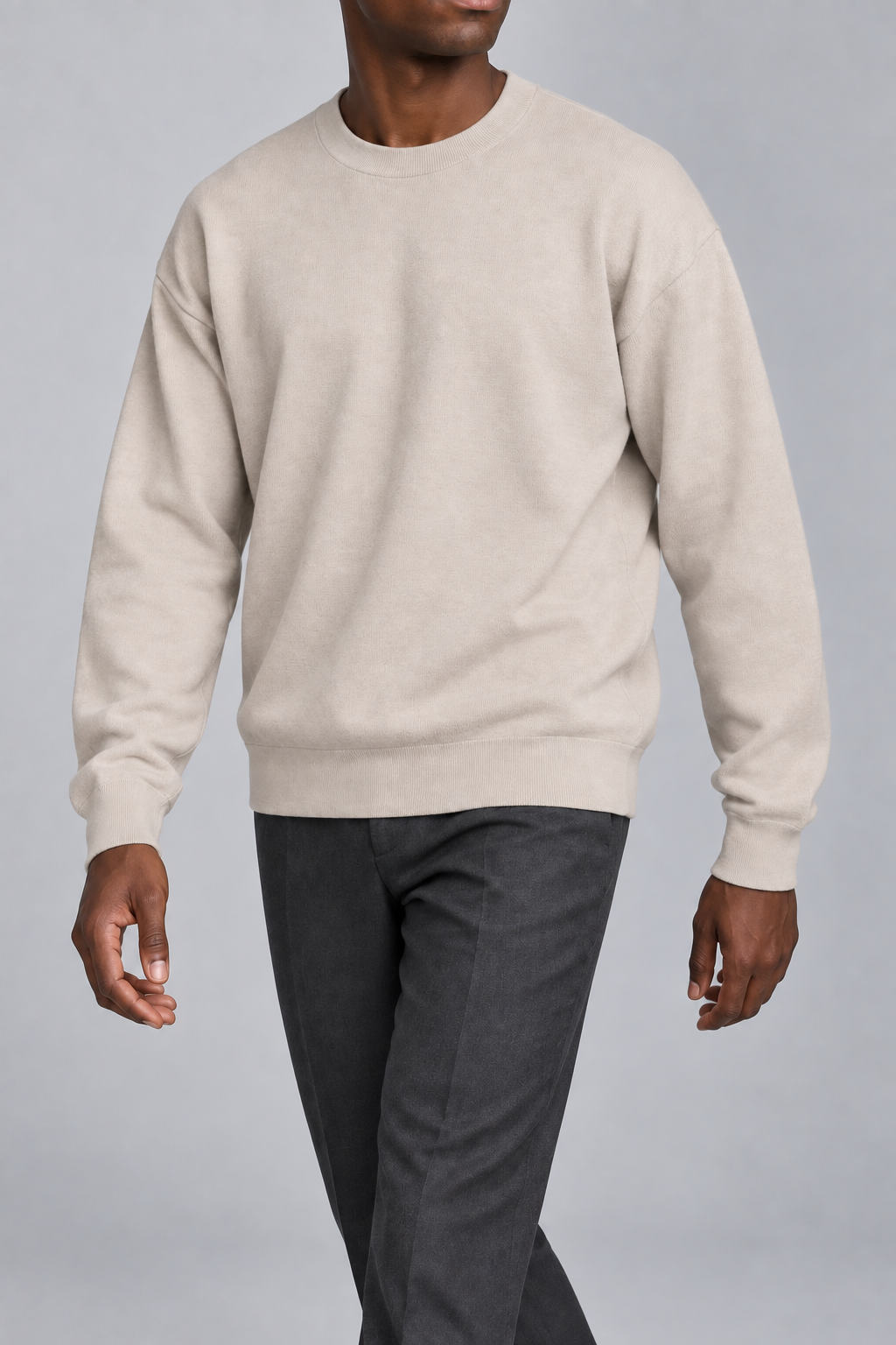 Slow Days Relaxed Crewneck in Sand. Movement view showing the Sand sweater natural drape.