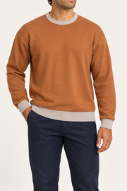 Slow Days Relaxed Crewneck in Rust with Coco Trim. Front view showing the Rust knit body and Coco contrast neckline, cuffs and hem.