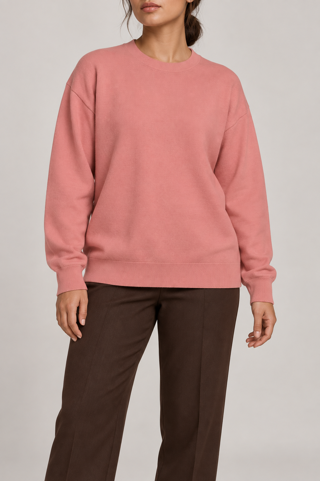 Soft Pause Relaxed Crewneck in Coral. Front view showing the plain Coral knit and relaxed crew neckline.