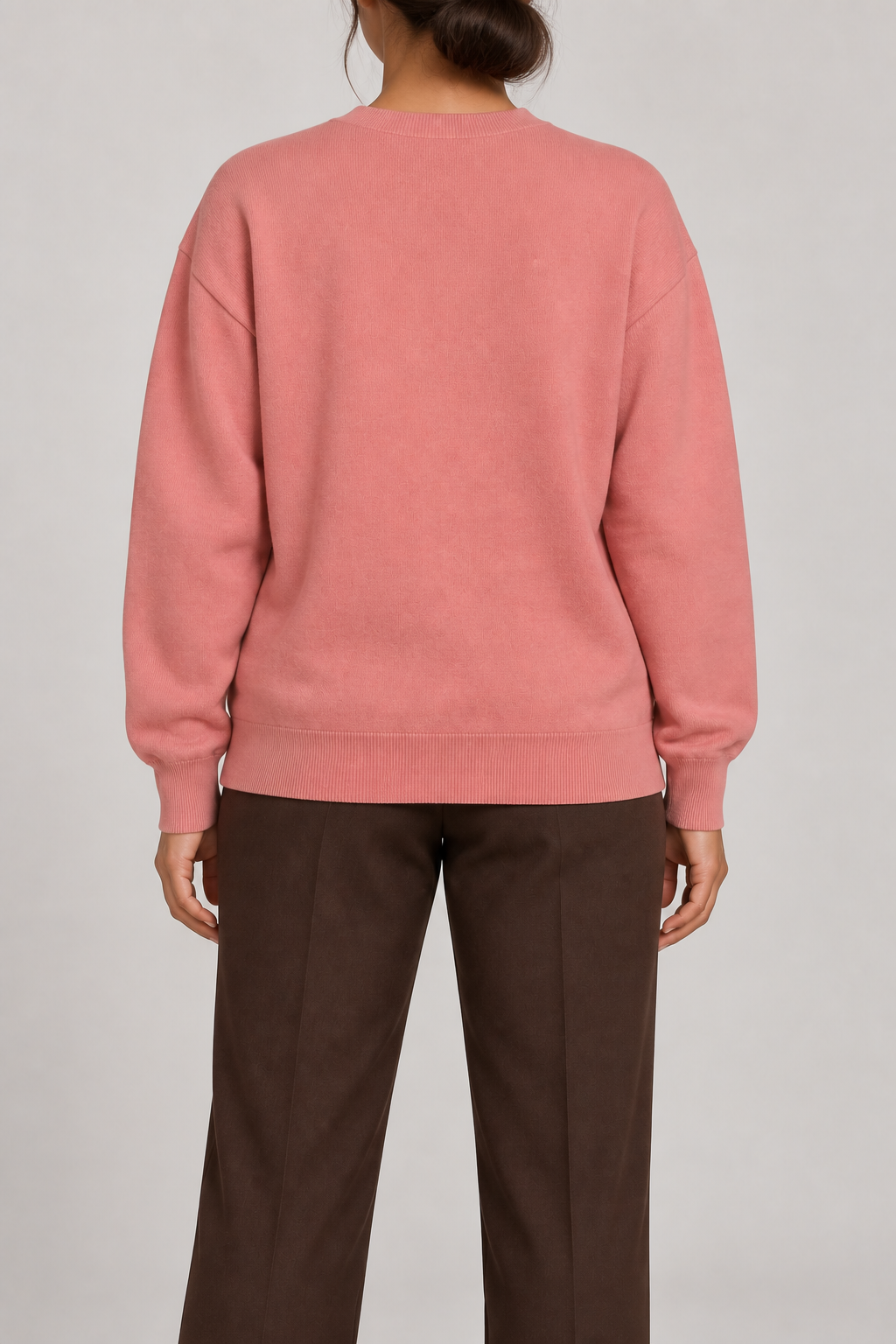 Soft Pause Relaxed Crewneck in Coral. Rear view showing the plain Coral back and matching ribbed hem.
