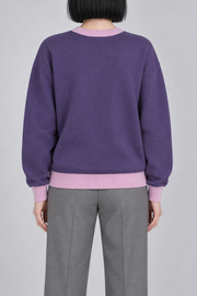 Soft Pause Relaxed Crewneck in Violet with Lilac Trim. Rear view showing the plain Violet back and Lilac trim.