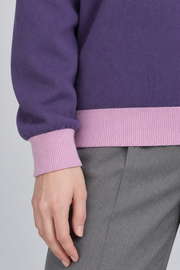 Soft Pause Relaxed Crewneck in Violet with Lilac Trim. Close-up showing the fine Violet knit and Lilac ribbed cuff and hem.