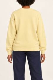 Soft Pause Relaxed Crewneck in Mellow. Rear view showing the plain Mellow back and matching ribbed hem.