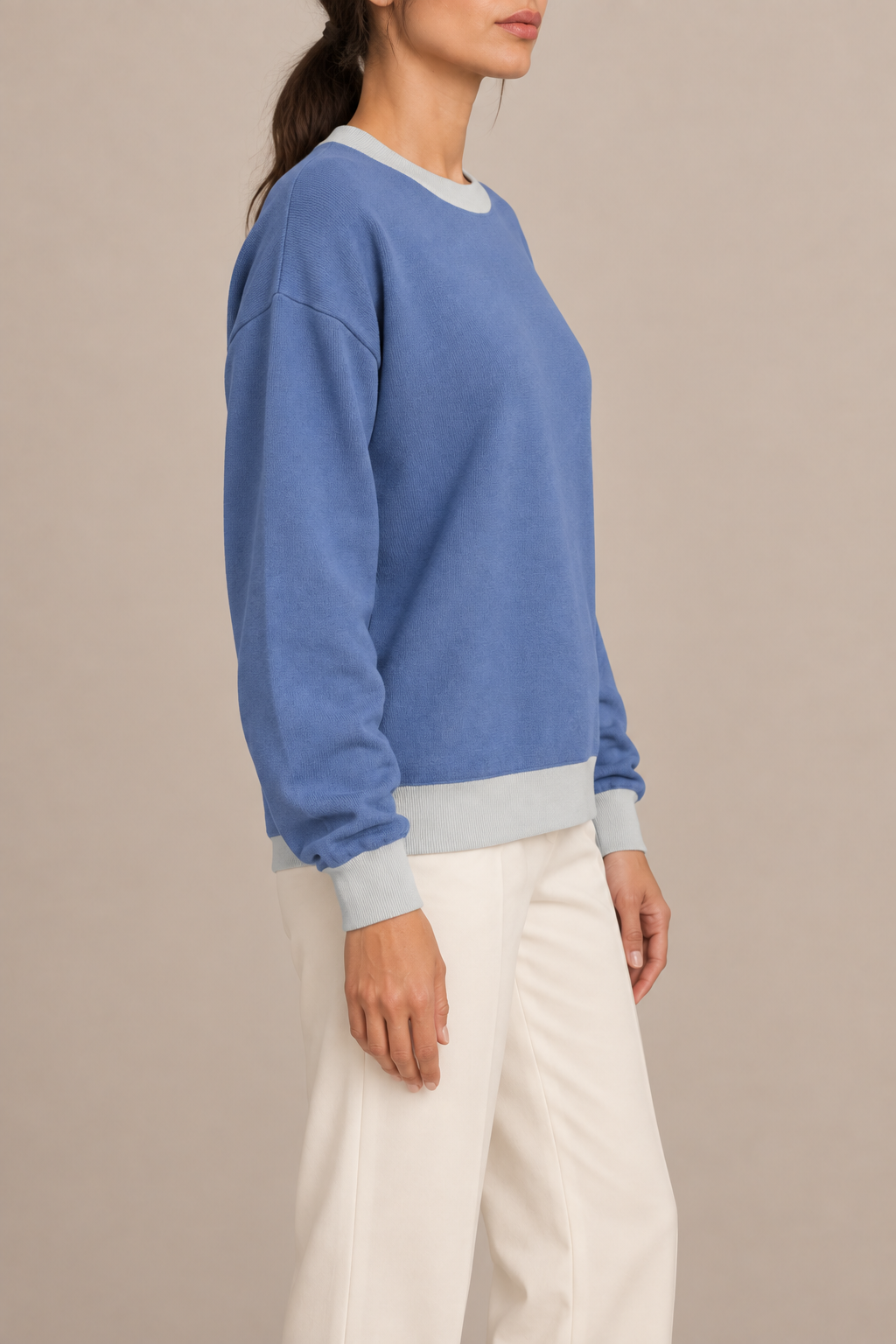 Soft Pause Relaxed Crewneck in Denim with Powder Trim. Side view showing the relaxed Denim silhouette and Powder trim.