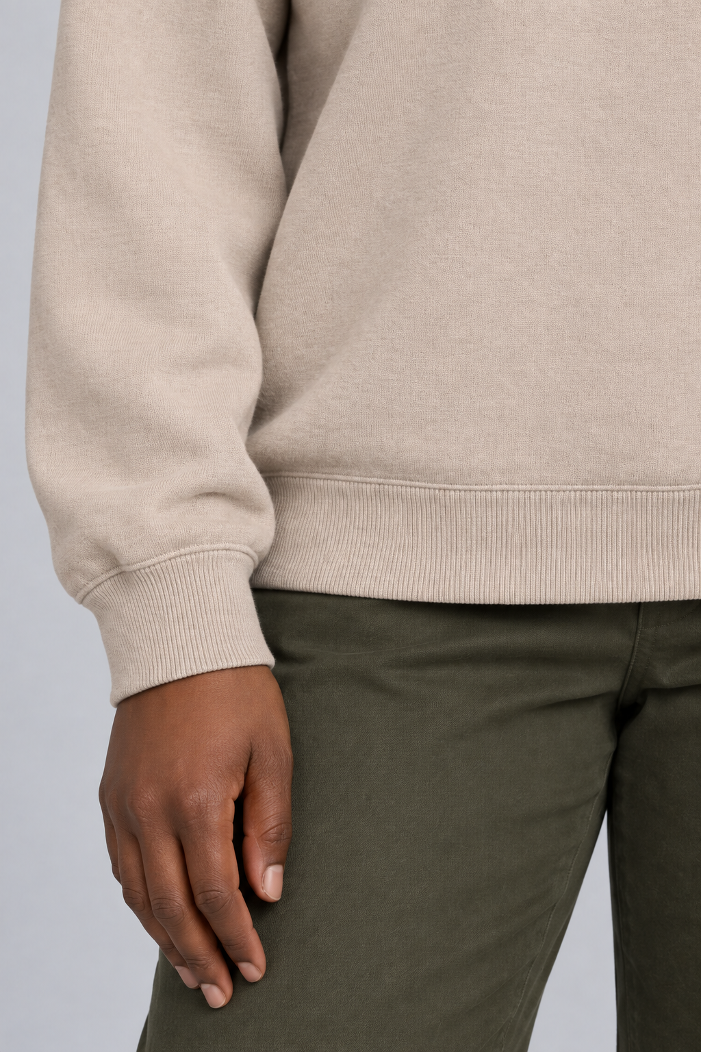 Soft Pause Relaxed Crewneck in Taupe. Close-up showing the fine Taupe knit and ribbed cuff and hem.