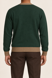 After Hours Cardigan in Pine with Peanut Trim. Rear studio view showing the plain knit back and contrasting cuffs and hem.