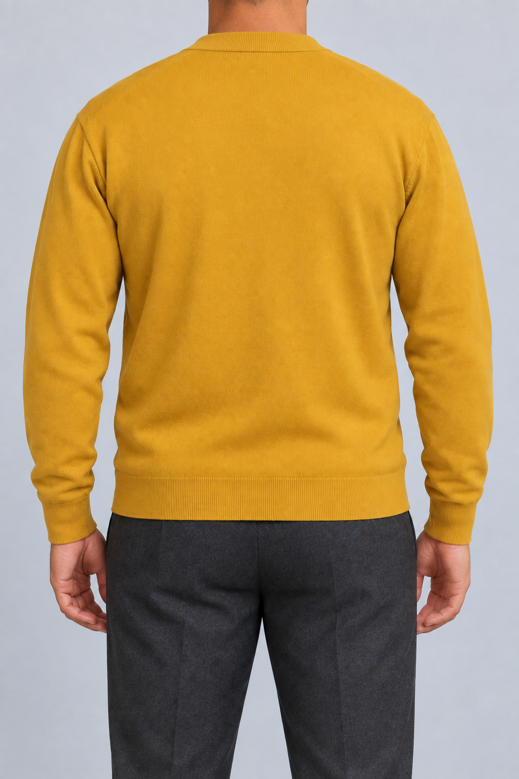 After Hours Cardigan in Mustard. Rear studio view showing the plain back and matching ribbed edges.