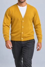 After Hours Cardigan in Mustard. Walking studio view showing the long sleeves and natural knit drape.