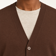 After Hours Cardigan in Soil. Close-up showing the V-neck trim, fine knit and upper button.
