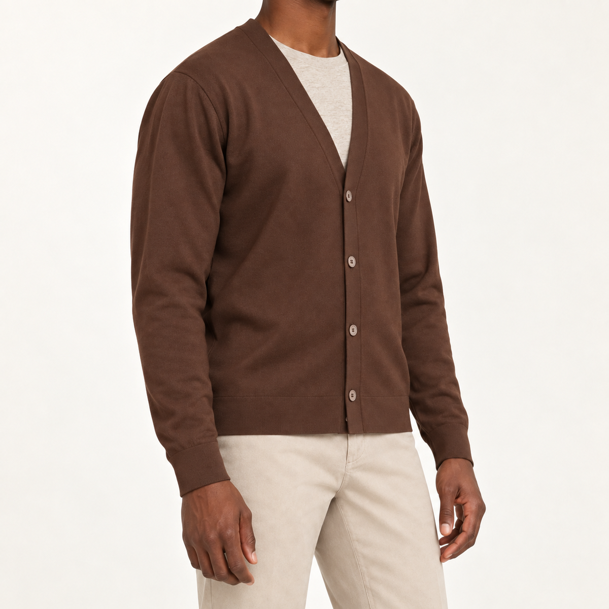 After Hours Cardigan in Soil. Three-quarter studio view showing the side silhouette and button front.
