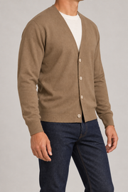 After Hours Cardigan in Peanut. Three-quarter studio view showing the side silhouette and button front.