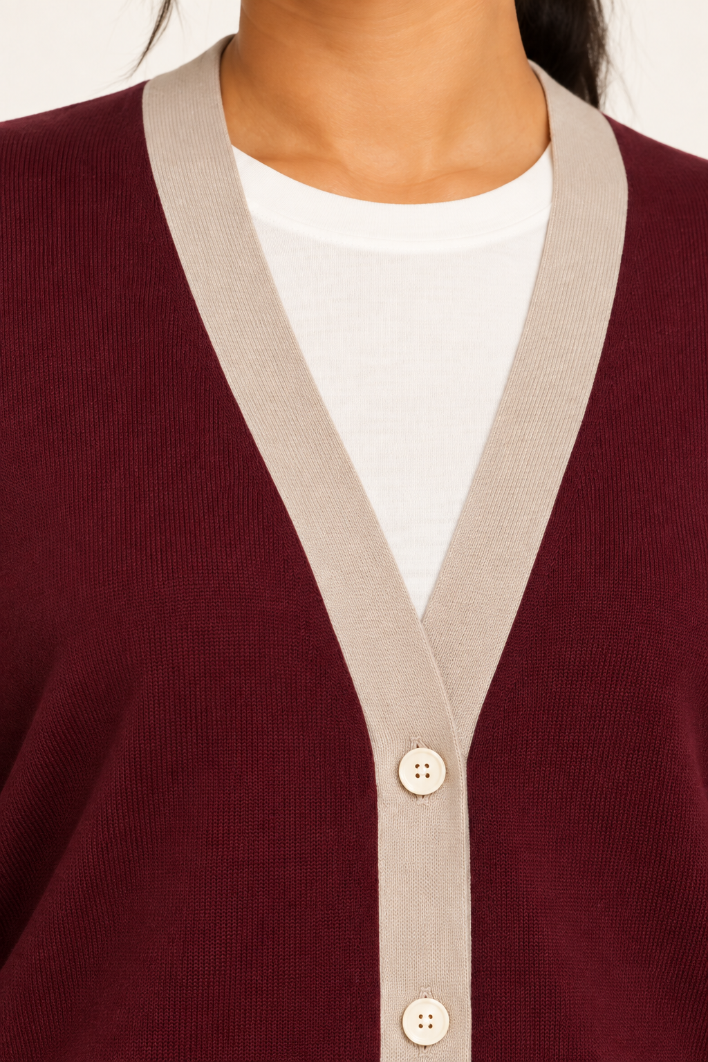 Soft Interval Cardigan in Burgundy with Coco Trim. Close-up showing the Coco V-neck trim, fine knit and buttons.