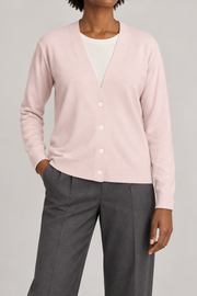 Soft Interval Cardigan in Lt Pink. Front studio view showing the plain knit and four-button V-neck front.
