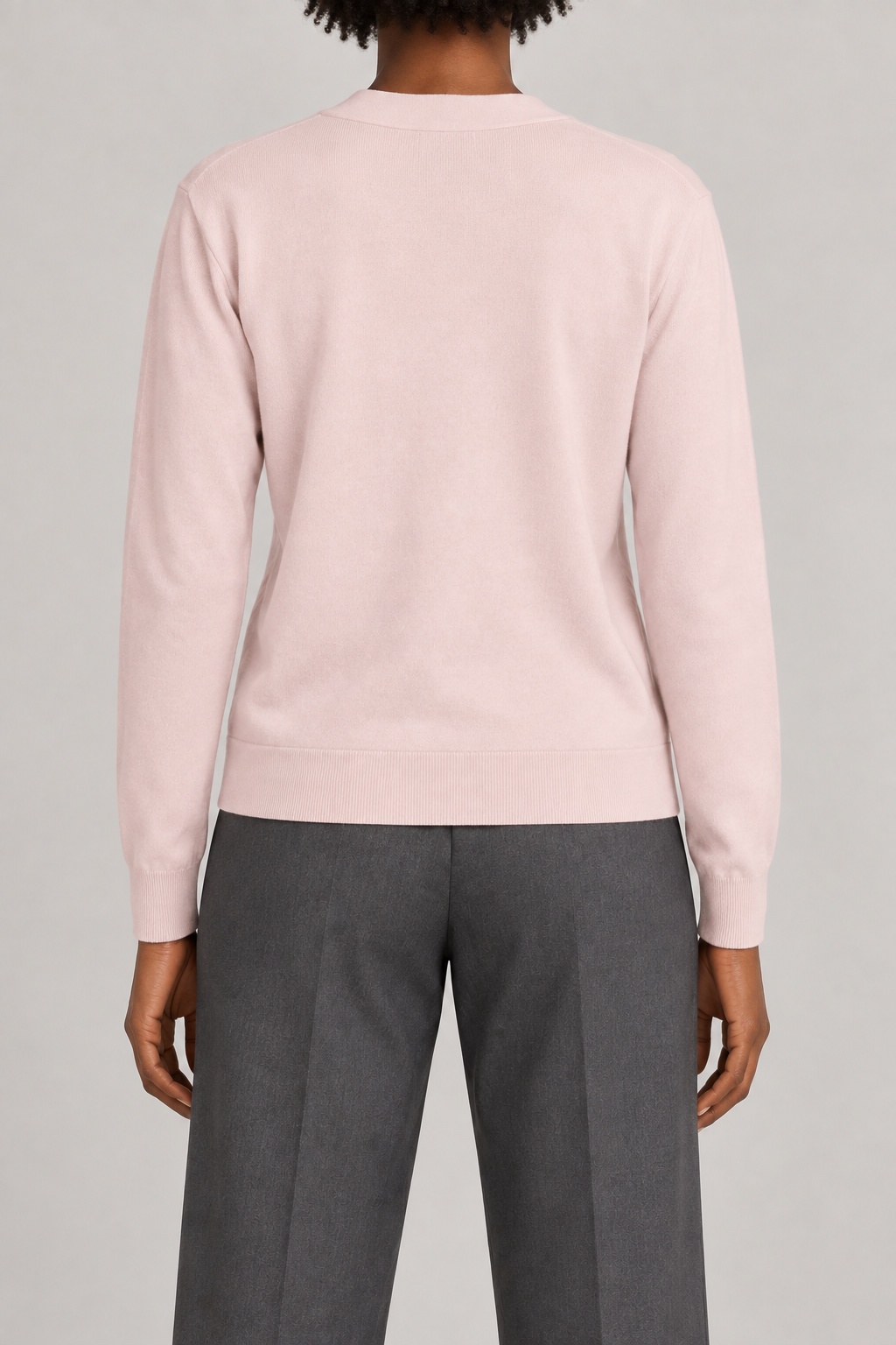 Soft Interval Cardigan in Lt Pink. Rear studio view showing the plain pink back and matching ribbed edges.