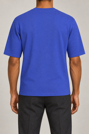 Rear studio view of Open Hours Knit T-Shirt in Royal, showing plain blue back and short sleeves.