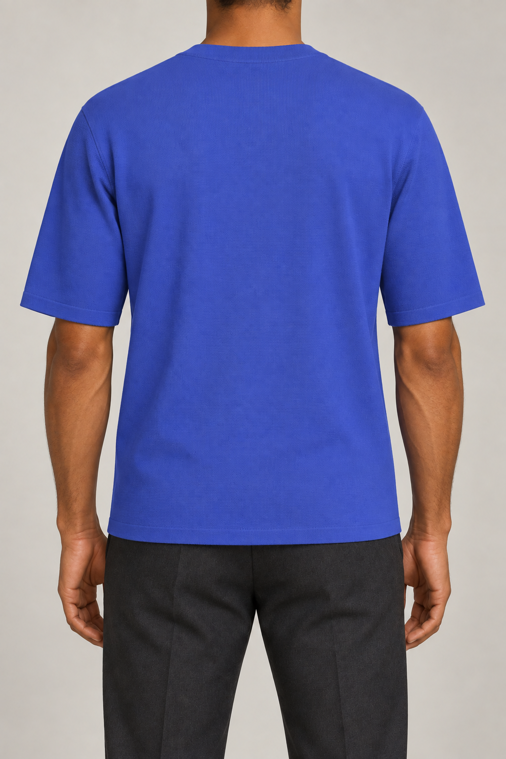 Rear studio view of Open Hours Knit T-Shirt in Royal, showing plain blue back and short sleeves.