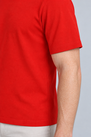Close-up detail of Open Hours Knit T-Shirt in Chili, showing red knit texture and short sleeve edge.