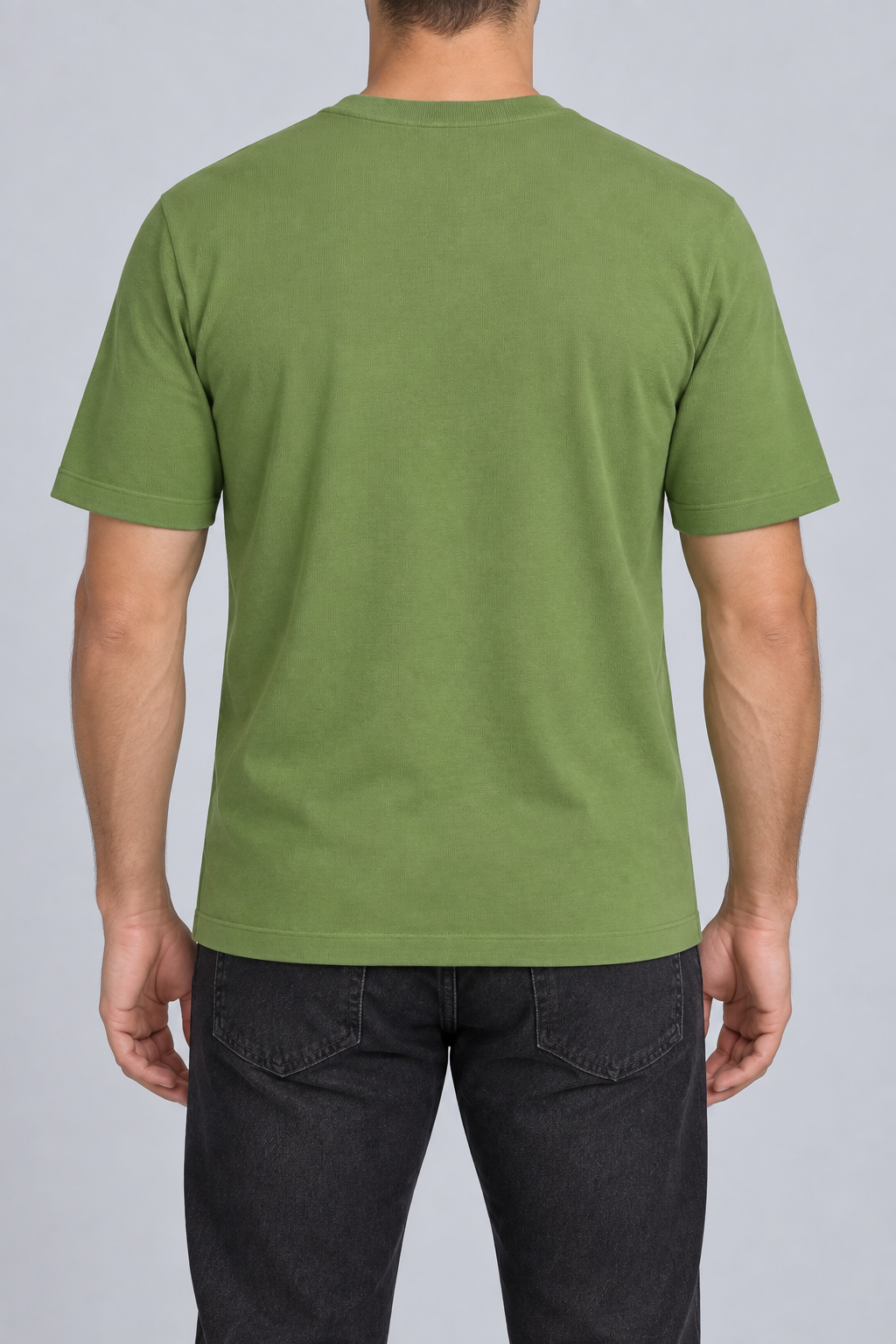 Rear studio view of Open Hours Knit T-Shirt in Grass, showing plain green back and short sleeves.