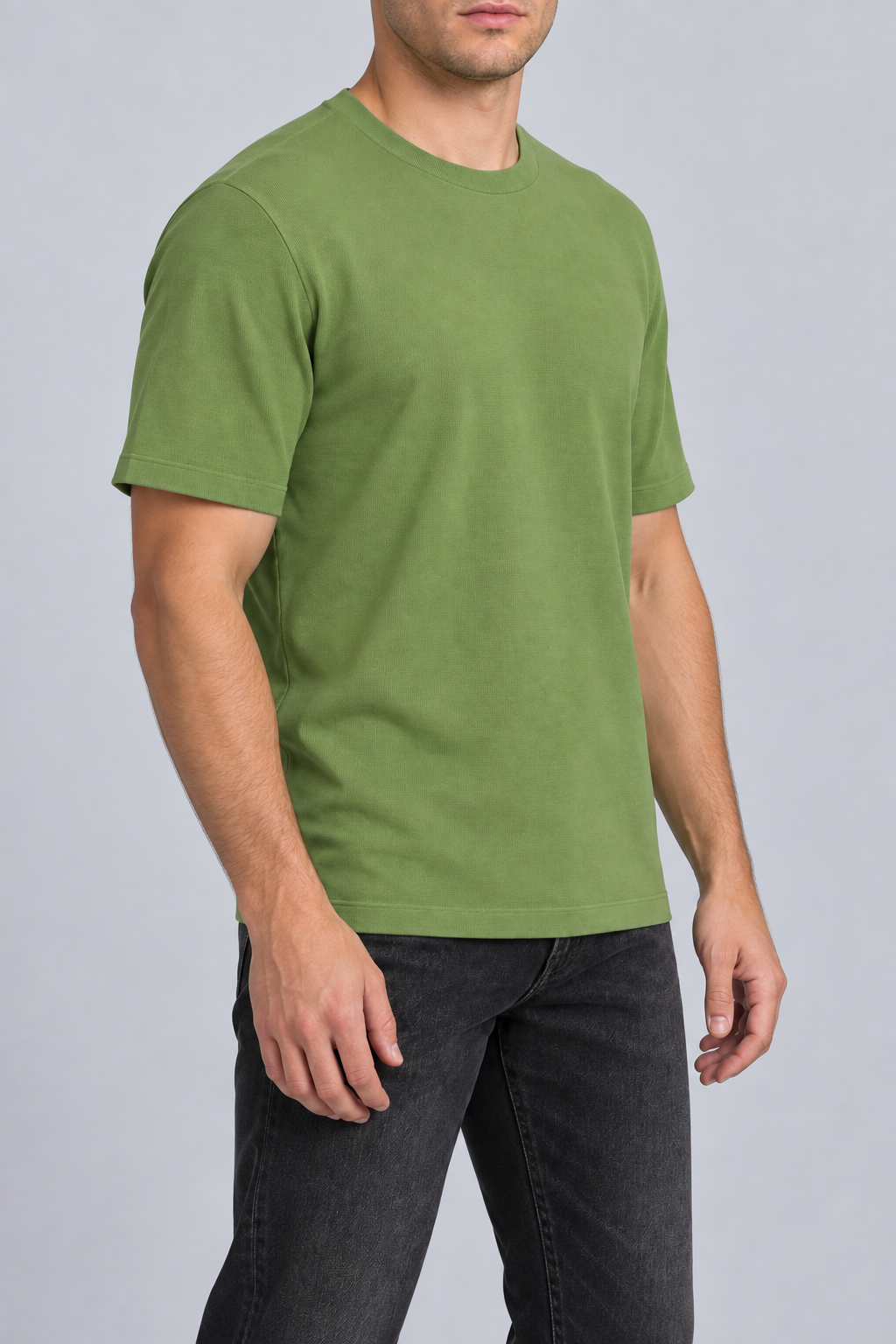 Three-quarter studio view of Open Hours Knit T-Shirt in Grass, showing short sleeves and clean green silhouette.